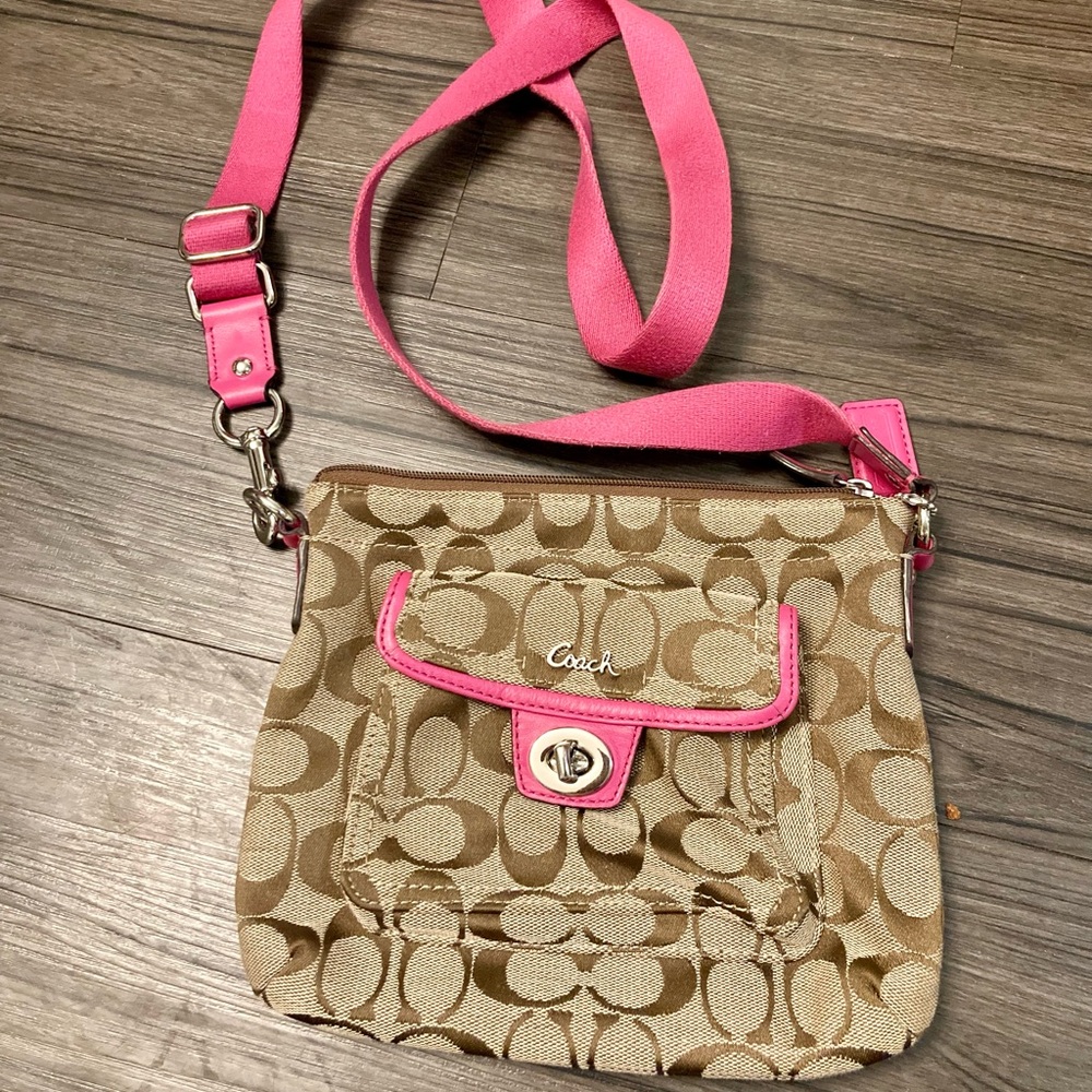 Brown and tan Coach purse with pink strap